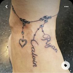 a woman's foot with a tattoo that says, love and two hearts on it