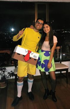 a man and woman dressed up in costumes