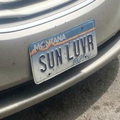 the license plate for sun - luvr is displayed in front of a car