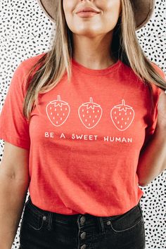 This cute shirt features three strawberries and the words "Be a Sweet Human." This trendy design will be one that you reach for again and again! Strawberry Clothes, Cottagecore Aesthetic Clothes, Cottage Core Clothes, Cottagecore Aesthetic Fashion, Core Clothes, Etsy Shirts, Fruit Shirt, Strawberry Shirt, Kindness Shirt