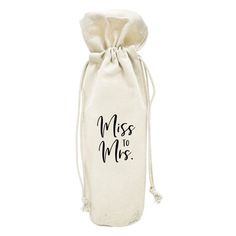 a white bag with the words miss to mrs printed on it, and a drawstring