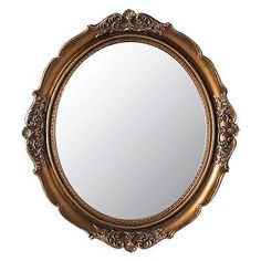 an ornate gold framed mirror on a white background with clipping for text or image