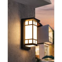 an outdoor light that is on the side of a building