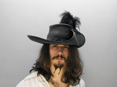 Musketeer (Black) FREE SHIPPING* Pirate Larp, Costume Pirate, Medieval Cosplay, Feather Centerpieces, Historical Reenactment, Black Costume, Pirate Hats, Leather Hat, Feather Hat