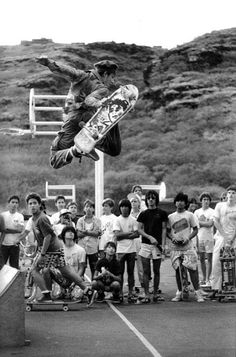 a man flying through the air while riding a skateboard on top of a ramp