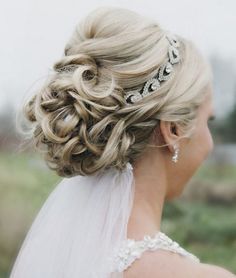 a woman with blonde hair wearing a tiara