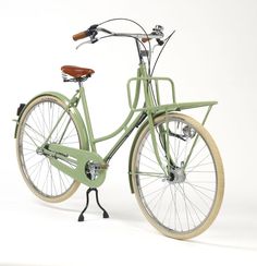 a green bicycle is shown on a white background with no people around it and the front wheel has a wooden handlebar