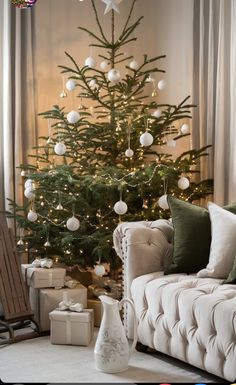 a living room with a christmas tree in the corner