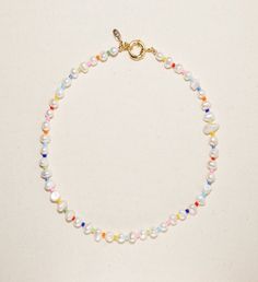 This clasp is so versatile and such an adorable detail, it can be worn in the front or in the back. Size: Pictured as 17" " . It brings you a perfect combination of the classic design and fun with our signature nautical clasp. | Pearl and rainbow beads necklace This elegant handmade necklace is an eye- catching piece that will surely bring lots of compliments. | 1-800-Flowers Gifts Delivery Amber Necklace Jewlery Necklace, Rainbow Pearl, Diy Jewelry Necklace, Beaded Necklace Designs, Beaded Necklace Diy, Necklace Tutorial, Jewel Necklace, Rainbow Necklace, Handmade Jewelry Necklace