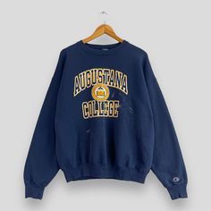 "REMINDER: THIS IS USED CLOTHING PLEASE DO NOT EXPECTED IT LIKE TO BE NEW OR IN PRISTINE CONDITION Feel free to contact me for any question. I'll assist you with my pleasure. Vintage CHAMPION Crewneck Sweatshirt Large 1990s Champion Augustana College Sportswear Jumper Champion Usa Blue Pullover Sweater Size L *All measurements are taken with the garment flat on the ground. SIZE ON TAG :- Size L ACTUAL SIZE MEASUREMENT :- ARM PIT TO ARM PIT :- 24.5\" inches BACK COLLAR TO HEM :- 25.5\" inches CONDITION :- GREAT USED CONDITION. HAVE PAINT DEFECTS AND DISCOLORATION (KINDLY REFER TO THE PICTURES ATTACHED) ** WE ARE USING DHL EXPRESS, IT TAKES 3-5 WORKING DAYS ONLY TO ARRIVE. PLEASE LEAVE YOUR PHONE NUMBER ON THE NOTE WHILE MAKE A PURCHASE** REF : (11-06-2021) 1164" Blue Collegiate Sweatshirt For Campus, Blue Graphic Print Sweatshirt For Campus, Blue Varsity Tops For Campus, Blue Varsity Top For Campus Wear, Collegiate Blue Letter Print Sweater, Blue Varsity Sweater For Streetwear, Collegiate Blue Tops For Campus, Blue Collegiate Tops For Campus, Varsity Blue Sweatshirt For Campus