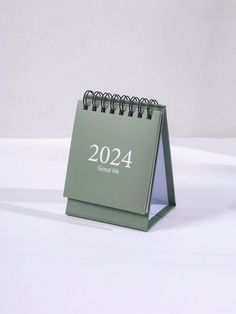 a desk calendar sitting on top of a table