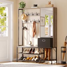 a shoe rack with shoes hanging on it in front of a mirror and coat rack