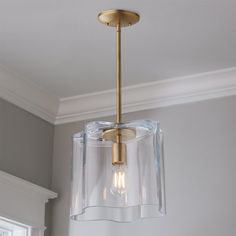 a light fixture hanging from the ceiling in a room