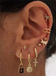 the ear is adorned with different types of earrings