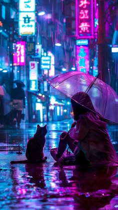 a woman sitting on the ground with an umbrella next to a cat in the rain