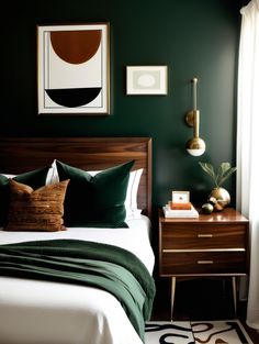 a bedroom with dark green walls and white bedding