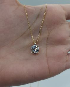 This is a beautiful Lab Grown diamond design pendant. It is set in real solid 14Kt Gold and the chain is 14Kt Gold as well.  You can choose if you want 14Kt White Gold, 14Kt Yellow Gold or 14Kt Rose Gold.  It has a special loop where the chain goes through so that the diamond sits comfortably on you when you wear it. We have a lot of beautiful jewelry with natural diamonds.  If any listing states "diamond" then it is a natural diamond. If the listing states "Lab Grown" it is a Lab Grown diamond. Gold Solitaire Necklace With Vvs Clarity, Dazzling Gold Solitaire Necklace With Vvs Clarity, Gold Moissanite Necklaces With Round Cut, Gold Moissanite Round Cut Necklaces, Gold Moissanite Round Cut Necklace, 14k Gold Solitaire Necklace With Diamond Cut, Gold Dazzling Solitaire Necklace With Prong Setting, Gold Moissanite Solitaire Pendant Necklace, Gold Moissanite Diamond Necklace With Brilliant Cut