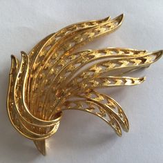 Monet Vintage Brooch.Gold plated.Made in USA in 1970's. Excellent vintage condition. Retro Gold Brooch For Anniversary, Retro Gold Brooches For Evening, Retro Gold Brooch For Evening, Retro Gold Collectible Pins, Gold Retro Brooches For Evening, Vintage Gold Pins For Party, Vintage Monet, Vintage Brooch, Dream Jewelry