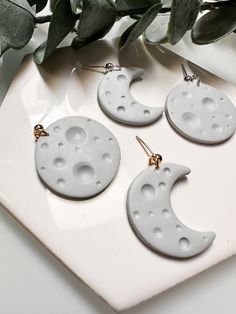 Detailed moon earrings. Each pair comes with one full moon and one crescent moon. Lightweight earrings, you'll forget you even have them on! White Round Moon Phase Earrings, Moon-shaped White Earrings For Gift, White Moon-shaped Earrings As Gift, White Moon-shaped Earrings For Gifts, White Handmade Moon-shaped Earrings, White Celestial Earrings With Moon Charm, White Moon-shaped Earrings For Pierced Ears, White Crescent Earrings As Gift, White Crescent Earrings For Gift