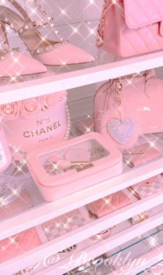 pink purses and handbags on display in a store