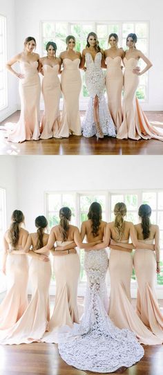 the bridesmaids are posing for pictures in their wedding gowns, and one is wearing