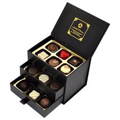 a black box filled with different types of chocolates