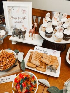 a table filled with desserts and cupcakes