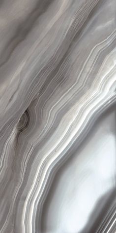 an abstract marble pattern with silver and white colors on the surface, as seen from above