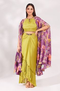 Purple shrug with floral print all over. Paired with padded lime top embellished with mirror work, cutdana, sequins and beads embroidery. Comes with draped skirt and matching bag. - Aza Fashions Georgette Shrug, Open Skirt, Casual Kurti, Shrug For Dresses, Beads Embroidery, Indo Western Dress, Draped Skirt, Beaded Neckline, Mirror Work