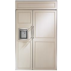 a white refrigerator freezer sitting inside of a wooden cabinet next to a metal door