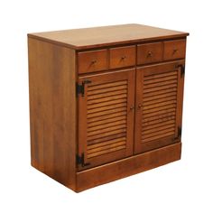 a wooden cabinet with shutters on the doors