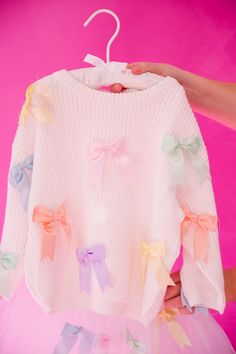 Hop into spring with our MINI KIDS PASTEL BOWS SWEATER! This cozy white waffle sweater features adorable pastel bows on the pullover, perfect for Easter or any day. Get your little one ready to bloom in style! This is a made-to-order item. All customized orders are currently shipping within 14 business days. To receive item quicker, expedited shipping is available at checkout. Pastel Bows, Waffle Sweater, Bow Sweater, Little One, In Style, Easter, Pastel, White, Clothes