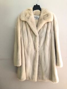 "The Evans Collection at Jordan Marsh Cream Fur Mink Stroller Coat Beautiful mink Cream lining Small stain inside lining, see photo Side pockets Measurements: Length: 34.5\" Sleeve length: 23\" Armpit to bottom hem: 20\" Across chest (armpit to armpit): 21\" Back collar height: 3\" Back across shoulder: 17.5\" Back armpit to armpit: 20.5\" Good condition 3 hook closures Label reads: \"The Evans Collection At Jordan Marsh\"" White Mink Coat, Cream Fur Coat, Beige Fur Coat, Glass Portrait, White Fur Coat, Cream Jacket, Mink Coat, Londonderry, Mink Fur Coat