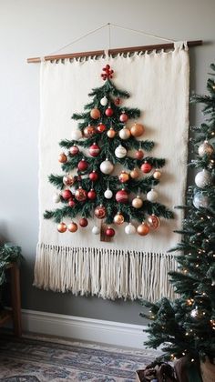 a christmas tree hanging on the wall with ornaments