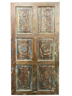 an old wooden door with decorative carvings on it