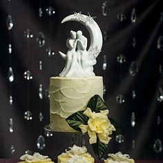 a wedding cake with yellow frosting and white icing