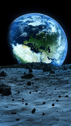 the earth seen from the moon's surface, with rocks and gravel in foreground