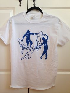 "A clean and simple rendition of Matisse's iconic \"La Danse,\" printed on a soft, eco-friendly Bella+Canvas tee. This classic unisex jersey short sleeve tee fits like a well-loved favorite. Soft cotton and quality print make users fall in love with it over and over again. These t-shirts have-ribbed knit collars to bolster shaping. The shoulders have taping for better fit over time. Dual side seams hold the garment's shape for longer. .: 100% Airlume combed and ringspun cotton (fiber content may Hand Painted T Shirts, Dance T Shirt, Fun Shirts, Paint Shirts, Perfect Gift For Boyfriend, T Shirt Painting, Custom Made Shirts, Painted Clothes, Gift For Boyfriend