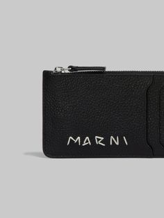 Card case made of milled calfskin leather. Four card slots. Central zip compartment. Hand-stitched Marni Mending logo on the front. Modern Leather Card Holder With Logo, Modern Leather Wallets With Engraved Logo, Mending Embroidery, Flat Heel Boots, Trunk Bag, Embroidery Shop, Leather Card Case, Boot Accessories, Women Essentials