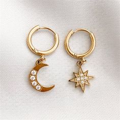 Add a touch of magic to your look with these cosmic earrings. These earrings are perfect for any occasion and a wonderful gift that can be enjoyed forever. Moon Hanging, Medical Instruments, Moon And Star Earrings, Luxury Diamonds, Star Moon, Hanging Earrings, Moon Earrings, Girls Earrings, Stainless Steel Earrings