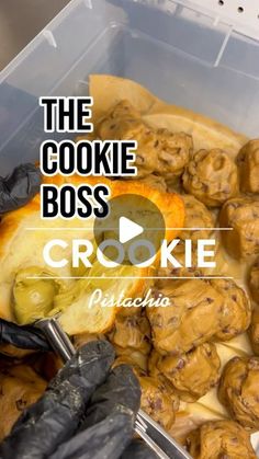 the cookie boss crockie recipe is in a plastic container with black gloves on it