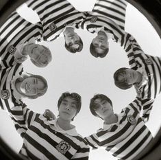 a group of young men standing in a circle