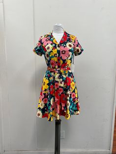 Measurements: X-Small: Bust is 31 inches and Waist is 25 inches Small: Bust is 33 inches and Waist is 26 inches Medium: Bust is 35 inches and Waist is 27 inches Large: Bust is 37 inches and Waist is 28 inches XL: Bust is 39 inches and Waist is 29 inches Retro V-neck Dress With Vibrant Print, Multicolor Floral Print V-neck Dress, Retro Floral Print V-neck Vintage Dress, Vibrant Print V-neck Cotton Dress, Retro Button-up Floral Print Dress, Rainbow Dress, Dress With Pockets, Dress Purchase, Large Bust