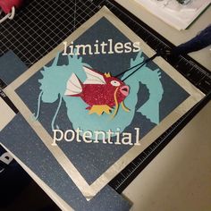 a graduation cap with the words limities potential on it and a red fish in the center