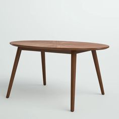 an oval wooden table with two legs and a small round top, on a white background