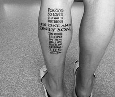 a man's legs with words written on them, and the word for god so loved