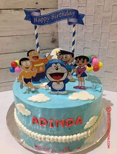 a birthday cake with cartoon characters on it