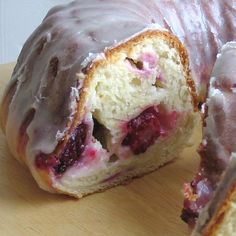 a doughnut that has been cut in half and is sitting on a cutting board