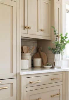 Eggshell Cabinets Kitchen, Tan Cabinets With Gold Hardware, Neutral And Gold Kitchen, Linen Cabinets Kitchen, Modern Taupe Kitchen, Natural Tan Kitchen Cabinets, Cream Cabinet Paint Color, Warm Kitchen Cabinets, Beige Cabinets Kitchen