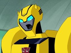 the animated character bum is wearing yellow and black with red accents on his chest, while he